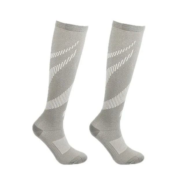 Experience all-day comfort and performance with knee-high compression socks from Brand NONE, designed for you as an athlete and everyday mover, with soft yet supportive fabric that improves your circulation and speeds recovery after workouts.